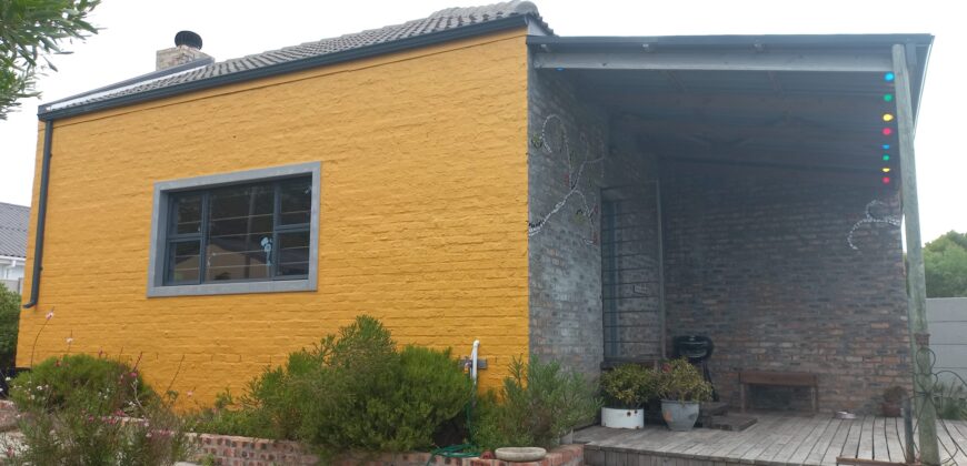 “The Little Yellow House with a Big Heart”