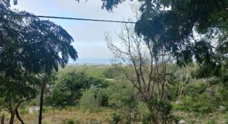 Large elevated sloped plot with terrific sea views over expansive  greenbelt to front