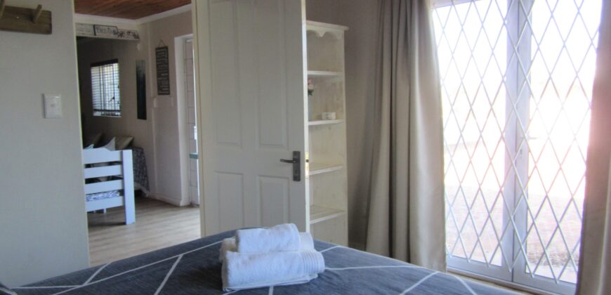 The Rustic Beach House —– ” Second row seats….. one plot back from the beach”