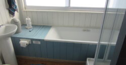 The Rustic Beach House —– ” Second row seats….. one plot back from the beach”